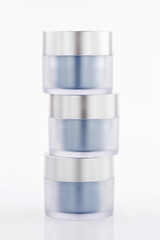 stack of Cosmetic containers isolated on white