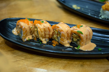 A piece of california roll, focus selective.