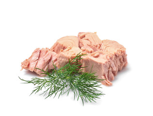 Pieces of canned tuna with dill on white background