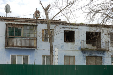 Homes in poor neighborhood where poor people live. Destruction of old houses, earthquakes, economic crisis, abandoned houses. Living in broken, unusable house is poor quarter. Odessa, Ukraine, 2019
