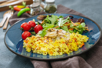 Andalusian fish, saffron rice with vegetables