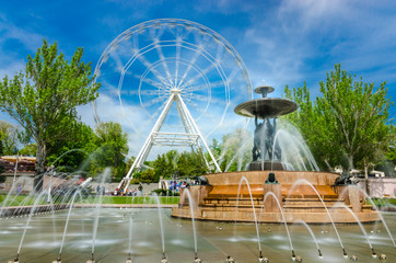 Rostov-na-Donu, Theatre square famous fountain with Atlants and Ferris wheel