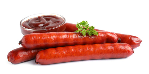 Delicious grilled sausages and sauce on white background. Barbecue food