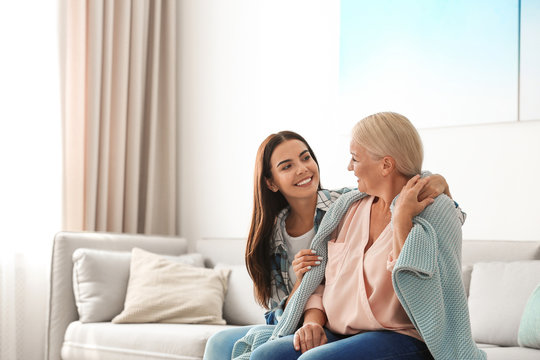 Daughter Taking Care Of Her Mother At Home. Help Concept