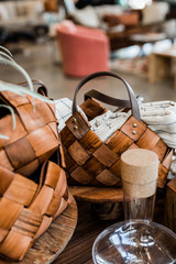Woven wood basket with leather strap