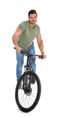 Handsome young man with modern bicycle on white background