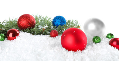 Fototapeta na wymiar Christmas decoration on snow against white background