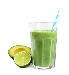 Glass of tasty smoothie with avocado and lime on white background