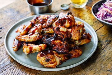 Barbecue chicken wings and drumsticks with sauce