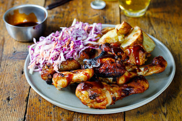 Barbecue chicken wings and drumsticks with sauce