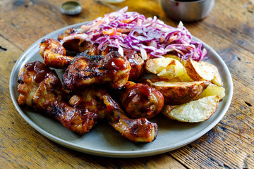 Barbecue chicken wings and drumsticks with sauce