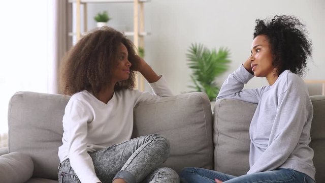 African Mother And Teenage Daughter Having Sincere Conversation At Home