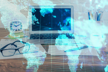 Double exposure of business theme icons and work space with computer background. Concept of success.