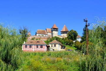 Fortified medieval saxon church in the village Alma Vii, Transylvania, Romania