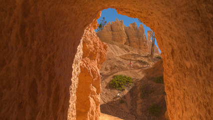 Female traveler walking down the switchback zigzag trail through Bryce Canyon NP