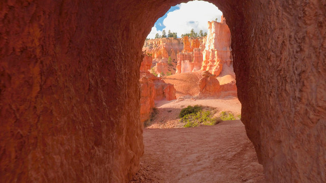 FPV: Walking along empty trail leading through hoodoo formations in Bryce Canyon