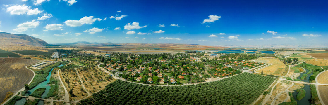 Aerial panorama view of Kibbutz Nir David in Northern Israel with surrounding agricultural land  