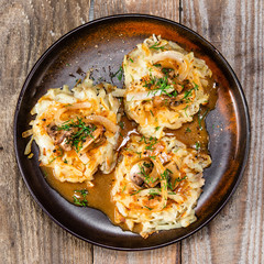 Potato cakes with gravy sauce and champignon