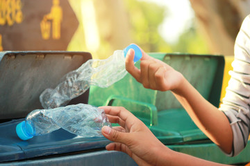 Group of kids volunteer help garbage collection charity environment, selective soft focus.