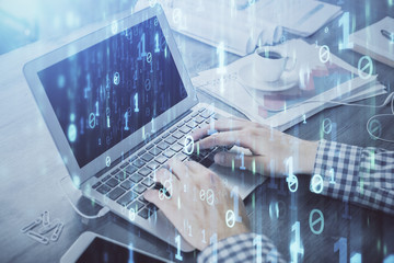 Double exposure of forex chart with man working on computer on background. Concept of market analysis.