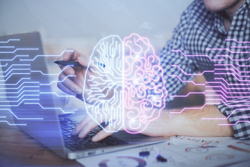 Man typing on keyboard background with brain hologram. Concept of big Data.