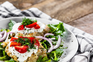 Potato cakes with sour cream and vegetables