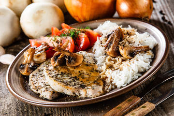 Grilled pork chop with white rice and mushroomson 