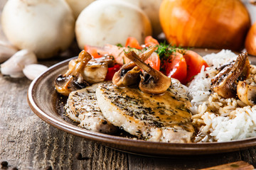 Grilled pork chop with white rice and mushroomson 