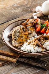 Grilled pork chop with white rice and mushroomson 