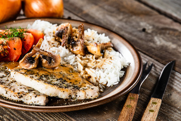 Grilled pork chop with white rice and mushroomson 