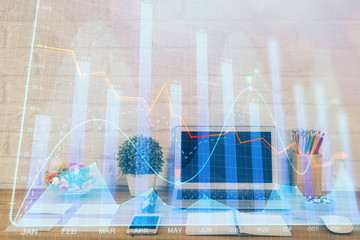 Financial graph colorful drawing and table with computer on background. Multi exposure. Concept of international markets.