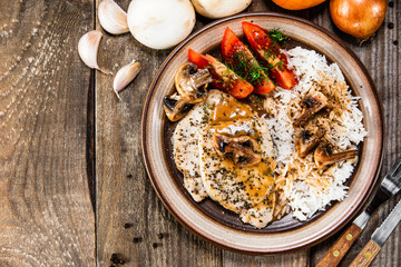 Grilled pork chop with white rice and mushroomson 