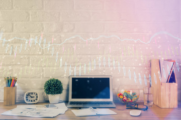 Financial chart drawing and table with computer on background. Multi exposure. Concept of international markets.
