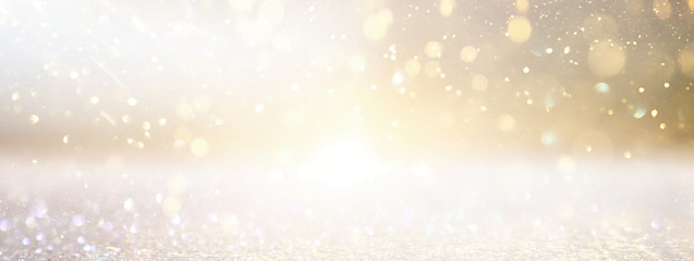 background of abstract glitter lights. silver and gold. de-focused. banner