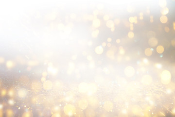 background of abstract glitter lights. silver and gold. de-focused