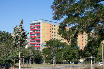 Typical modernized residential buildings in Leipzig district Grünau with blue sky, architecture...