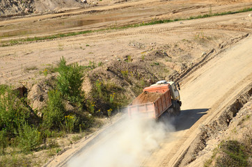 Belarus, Minsk region, open pit sand "Radoshkovichi". Dump truck transports sand and other minerals in the mining quarry.