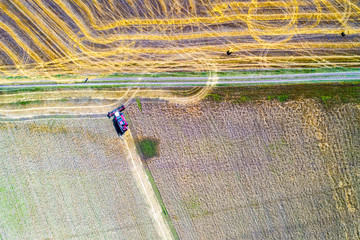 Harvester machine working in field . Combine harvester agriculture machine harvesting golden ripe...
