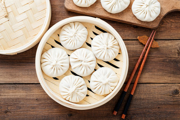 Raw dumplings Dim Sum in bamboo steamer. 