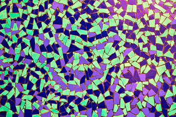 Colorful decorative tilework in broken blue and green tiles.