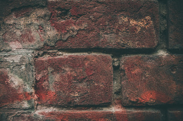 Old red bricks wall background. Grunge darked texture