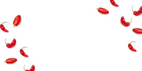 A lot of red hot chili peppers on a white background.