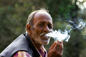 portrait of senior man smoking