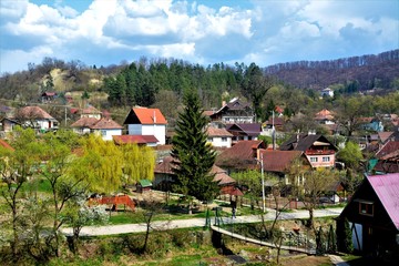 landscape with a rural locality between the hills of Transylvania