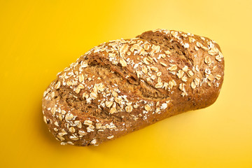 five grain bread on yellow table