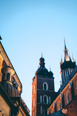 Obraz premium Night Architecture. travel and tourism concept, Poland Bazylika Mariacka. Krakow, Poland. vertical photo