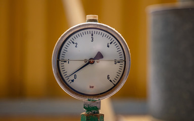 Industrial high pressure gas meters, pipelines and valves on blur background