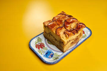 apple cake on yellow table