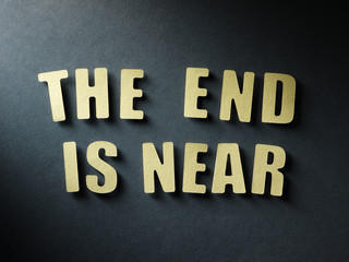 The word The End Is Near on paper background