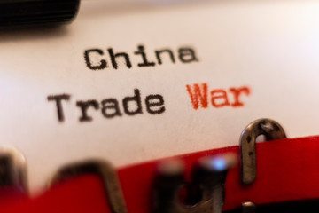 China Trade War typed on typewriter on black and red